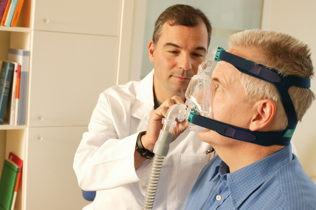 Doctor and patient with cpap device